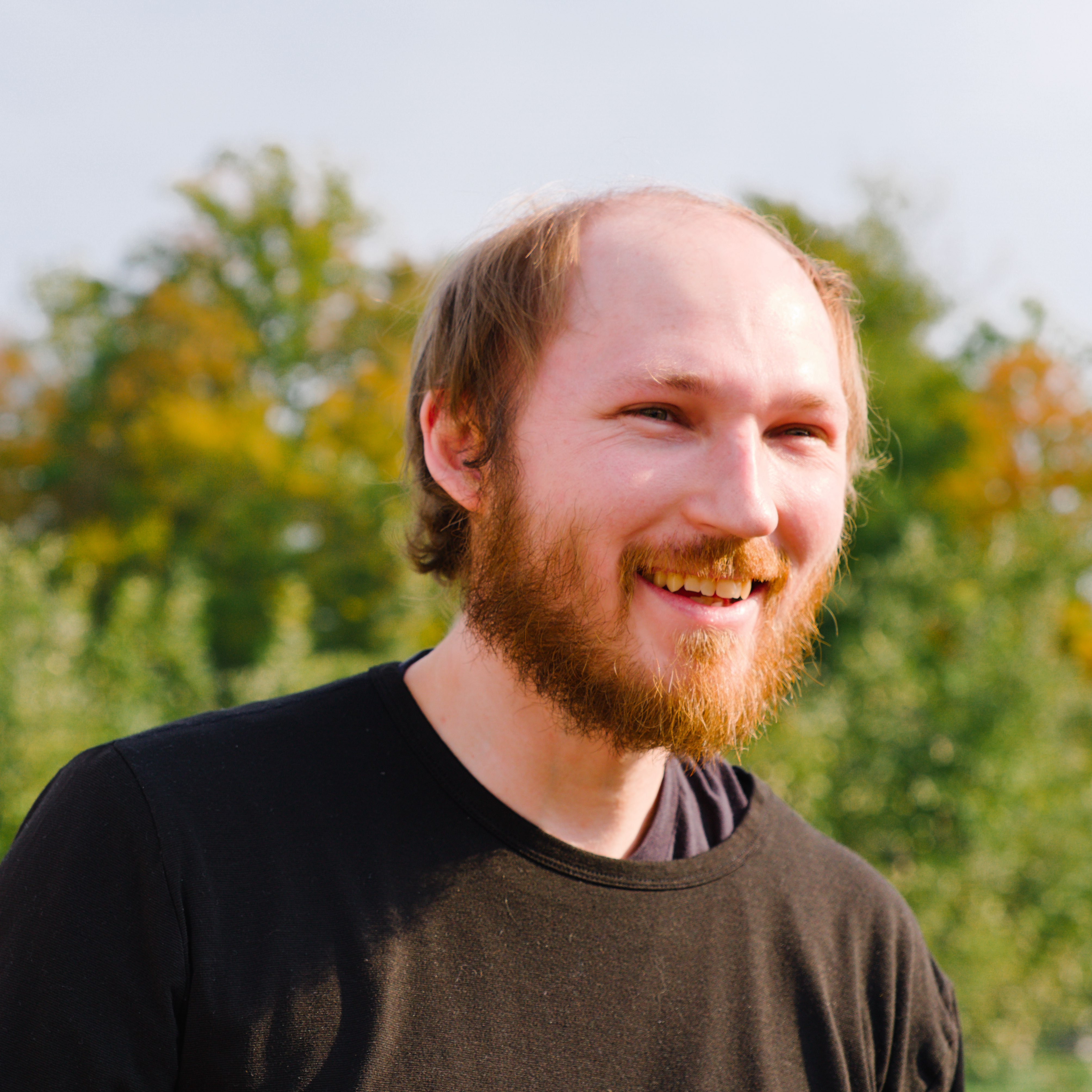 Portrait of Todd Cumzak smiling outdoors